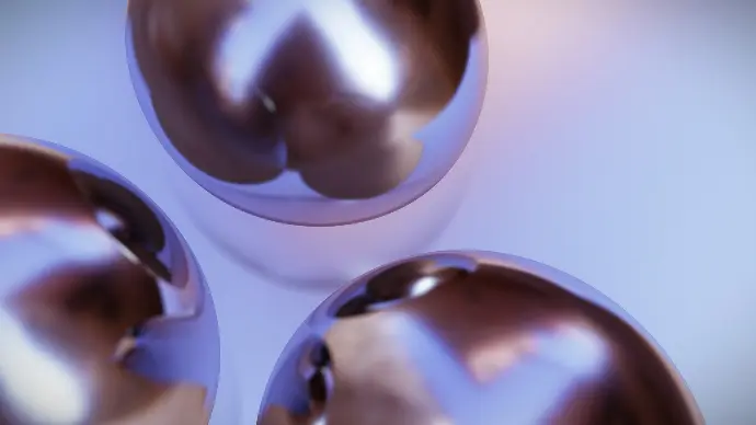 a group of shiny metal balls sitting on top of a table